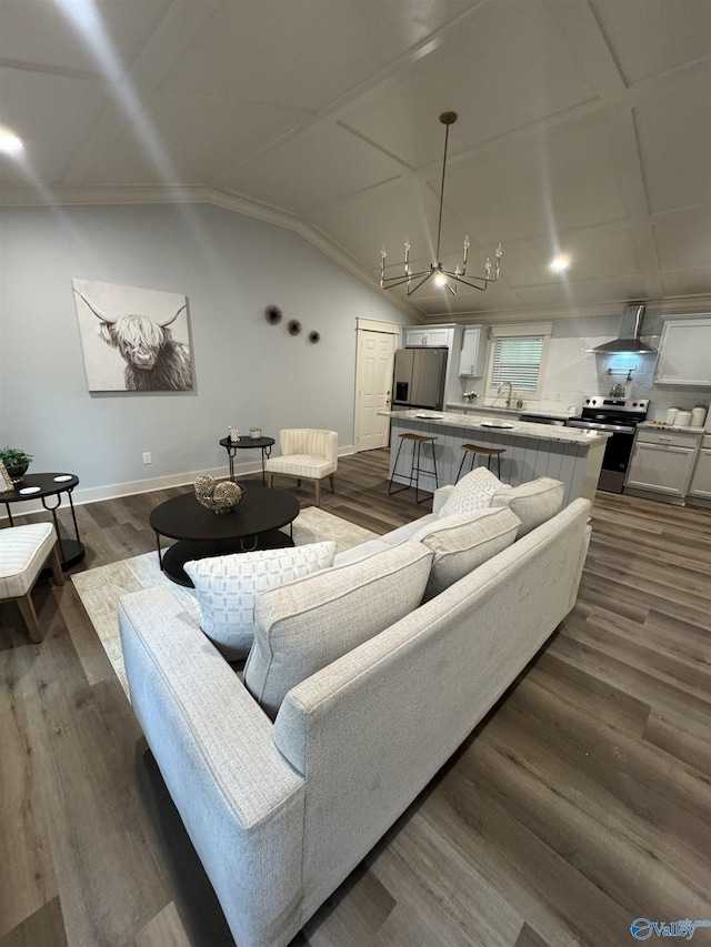 2205 Euclid Rd, Huntsville, AL 35810 - living room featuring dark wood finished floors, lofted ceiling, and baseboards
