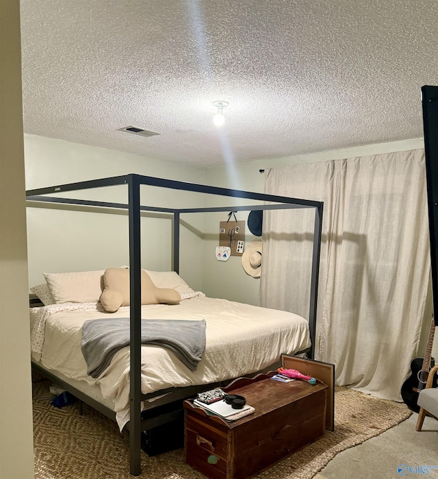 bedroom with carpet flooring and a textured ceiling