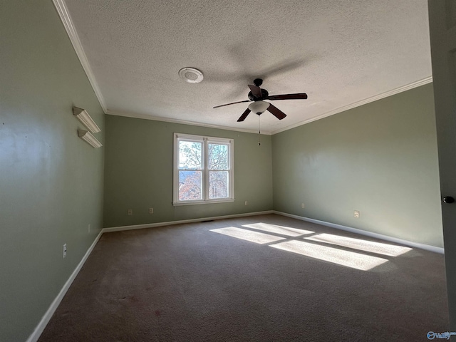 spare room featuring carpet, a textured ceiling, and ornamental molding