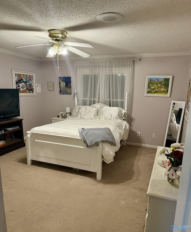 carpeted bedroom featuring a textured ceiling, ceiling fan, and ornamental molding