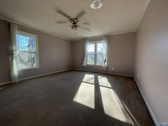 carpeted spare room with ceiling fan, crown molding, and a textured ceiling