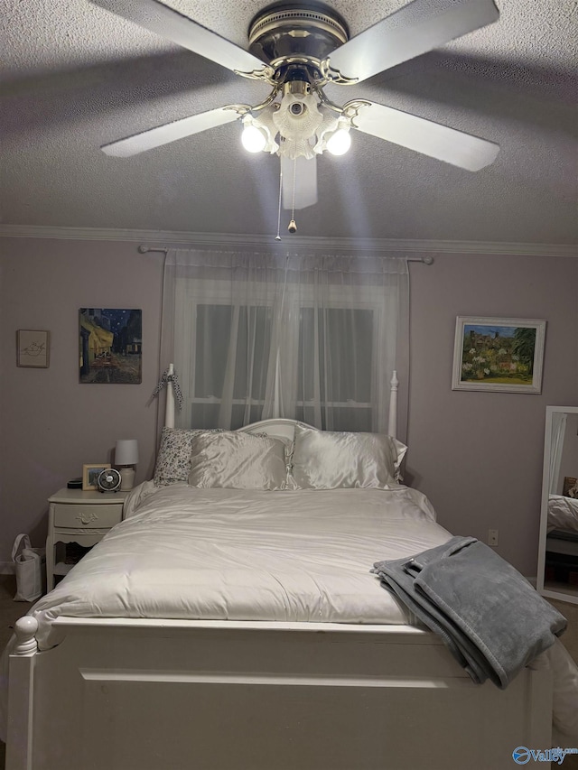 bedroom with ceiling fan, crown molding, and a textured ceiling