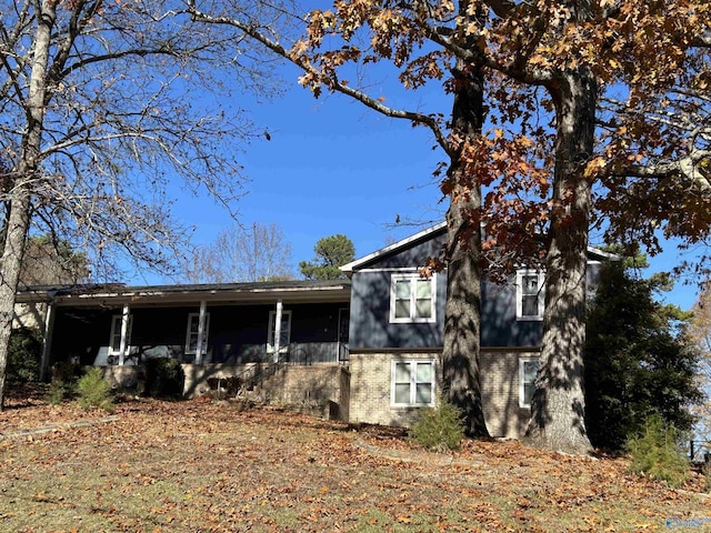 view of side of property with a porch