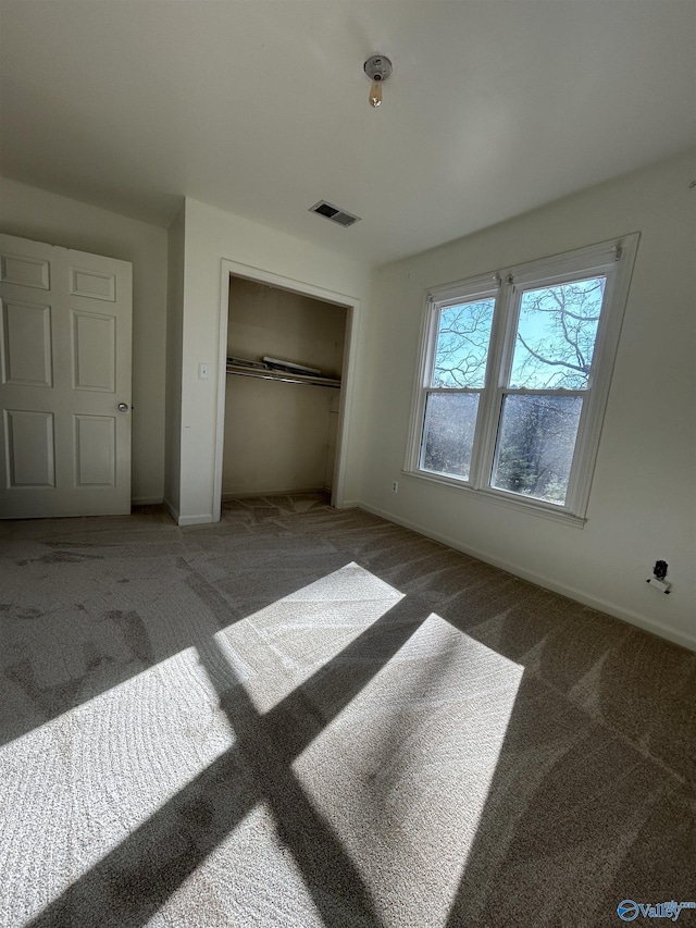 carpeted bedroom featuring a closet