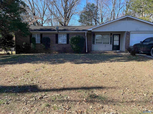 single story home with a front lawn and a garage