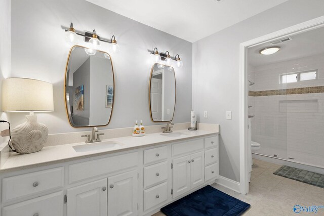 bathroom featuring walk in shower, vanity, and toilet