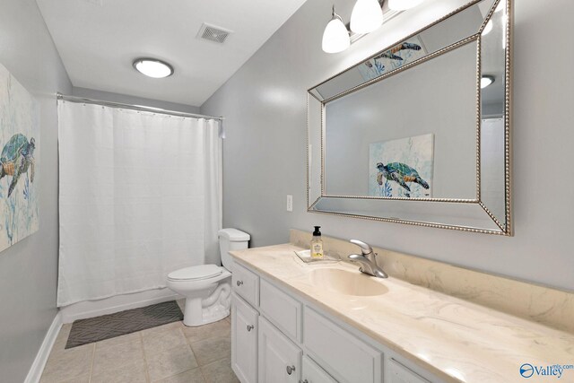 bathroom with toilet, vanity, and walk in shower