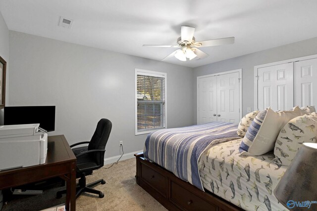 bedroom featuring ceiling fan and light colored carpet