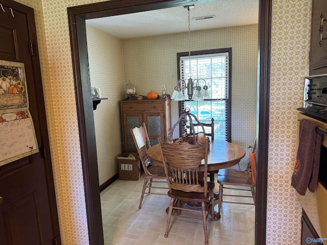 dining area with a textured ceiling