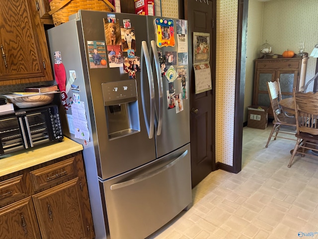 kitchen featuring stainless steel fridge