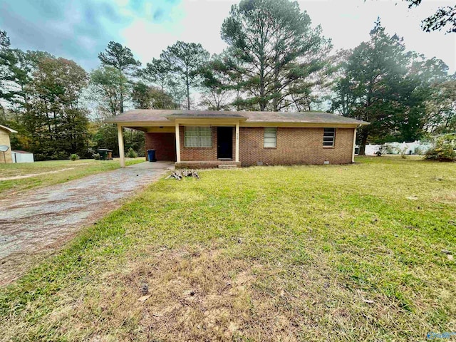 ranch-style home with a front lawn and a carport