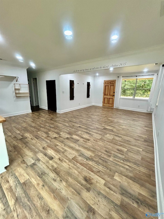 unfurnished living room featuring hardwood / wood-style floors