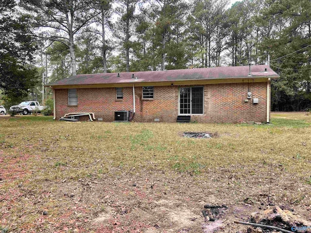 rear view of property with cooling unit