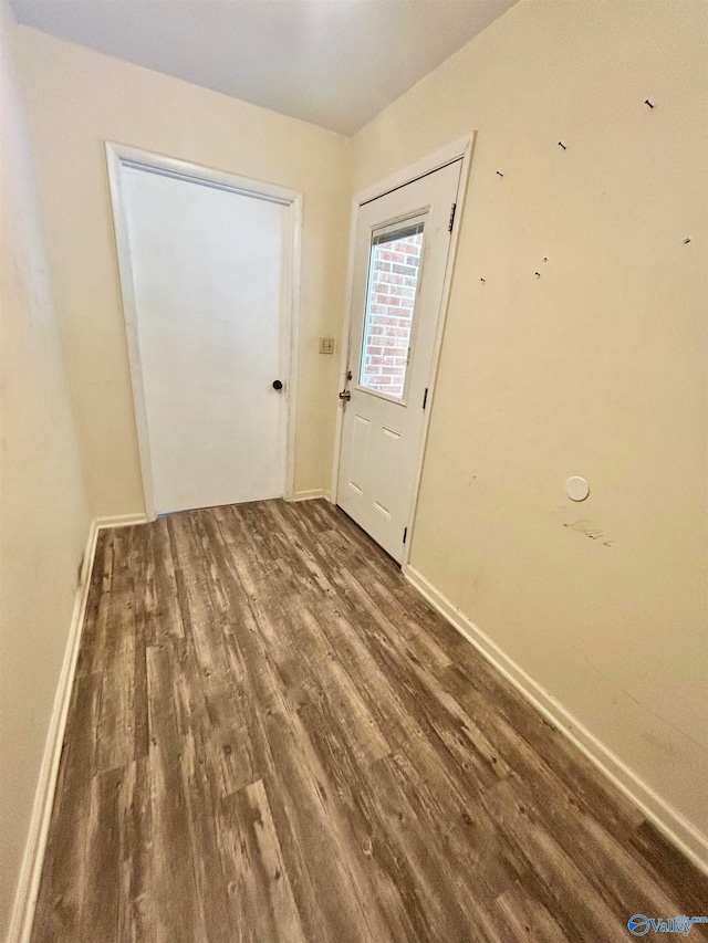 doorway to outside with dark hardwood / wood-style flooring