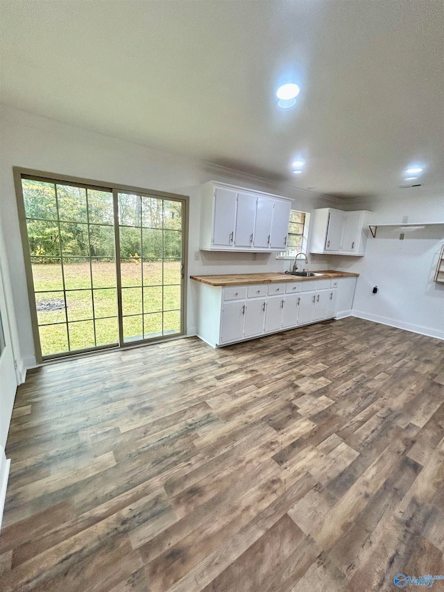 kitchen featuring sink, dark hardwood / wood-style floors, and white cabinets