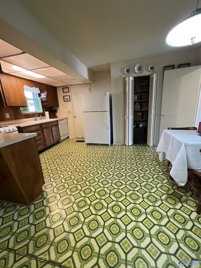 kitchen with sink and white appliances