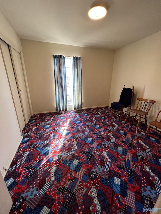 carpeted bedroom with a closet