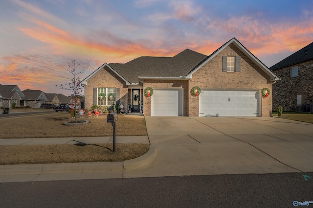 view of front property with cooling unit and a garage