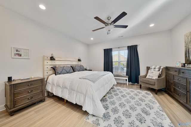 bedroom featuring ceiling fan and light hardwood / wood-style floors