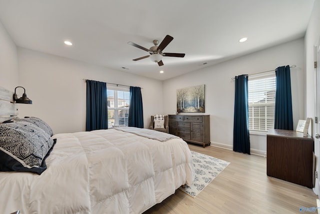 bedroom featuring ceiling fan and light hardwood / wood-style floors