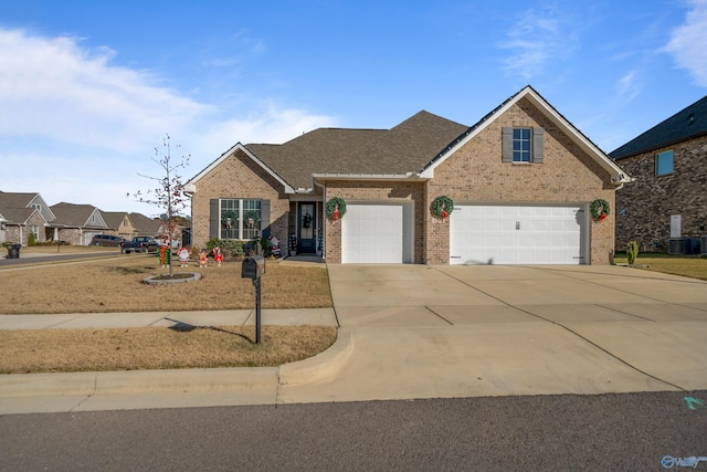 front of property with cooling unit and a garage