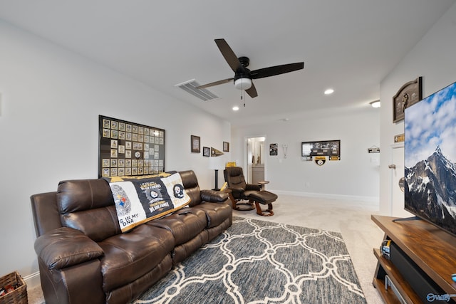 living room with ceiling fan and light carpet