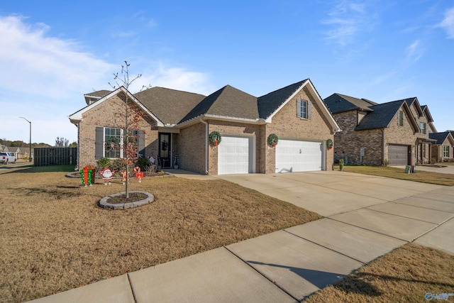 view of front facade with a garage and a front lawn