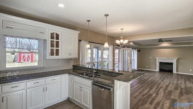 kitchen featuring white cabinets, sink, kitchen peninsula, and dishwasher