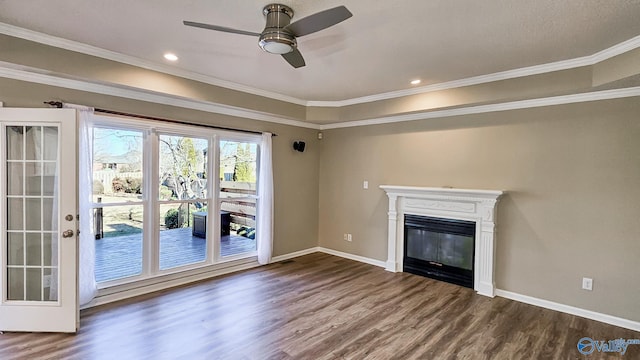 unfurnished living room with crown molding, ceiling fan, and dark hardwood / wood-style flooring