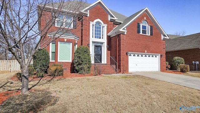 view of front property featuring a garage and a front lawn