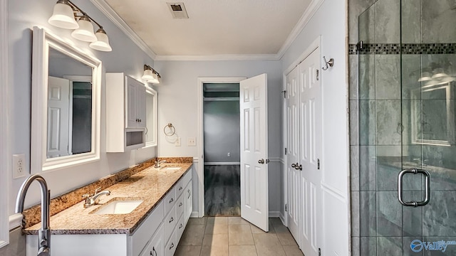 bathroom featuring crown molding, an enclosed shower, tile patterned floors, and vanity