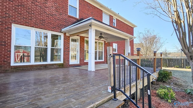 wooden terrace featuring ceiling fan