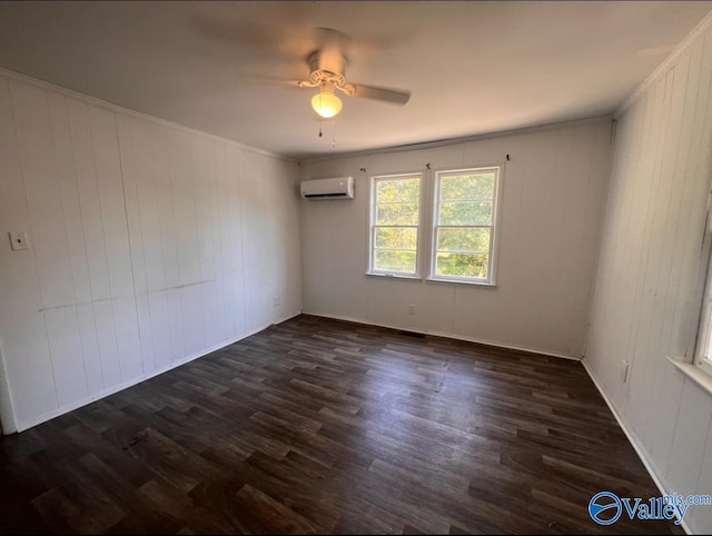 empty room with dark hardwood / wood-style flooring, wooden walls, ceiling fan, and a wall mounted air conditioner