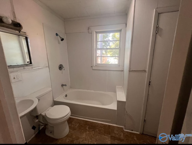 bathroom with shower / bathing tub combination and toilet