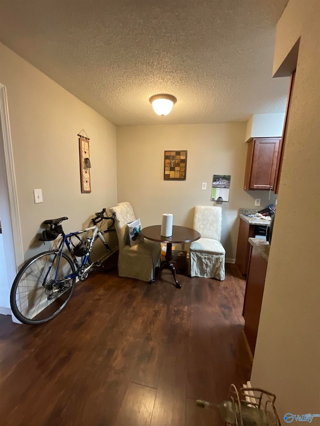 office featuring a textured ceiling and dark hardwood / wood-style flooring