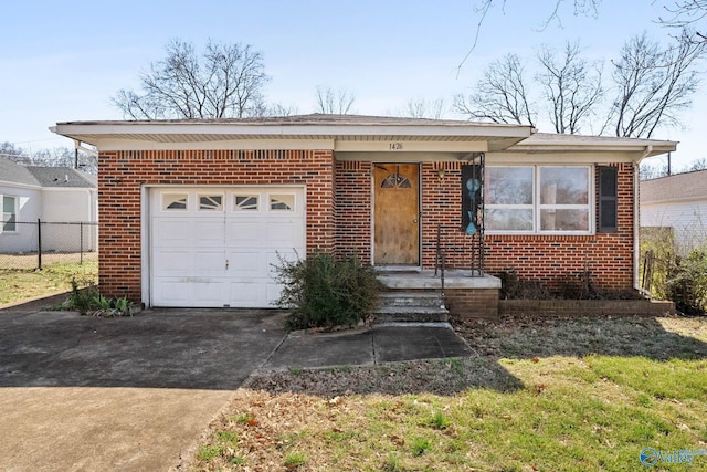 view of front facade with concrete driveway, brick siding, fence, and an attached garage