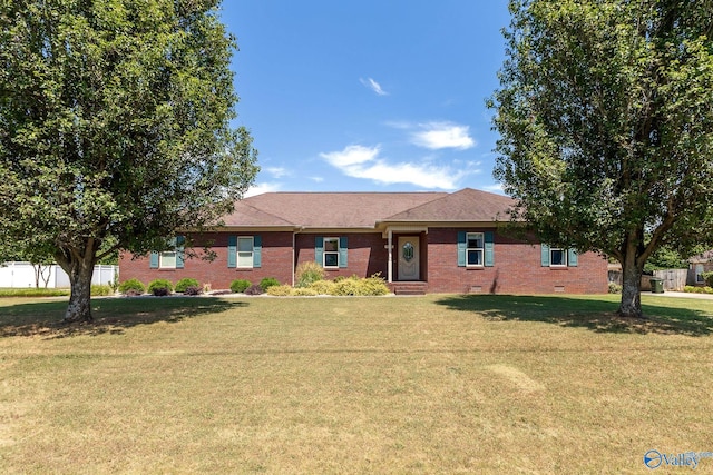 ranch-style house featuring a front yard