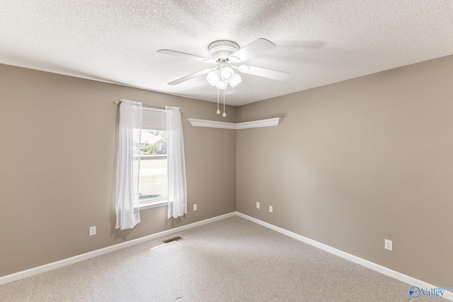 empty room featuring carpet, a textured ceiling, and ceiling fan