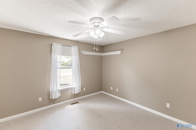 138 Singletree Dr, Hazel Green, AL 35750 - carpeted spare room featuring a textured ceiling, a ceiling fan, visible vents, and baseboards