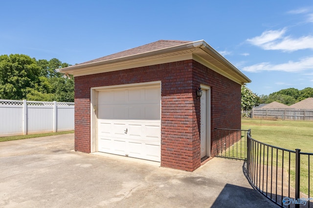 garage featuring a yard