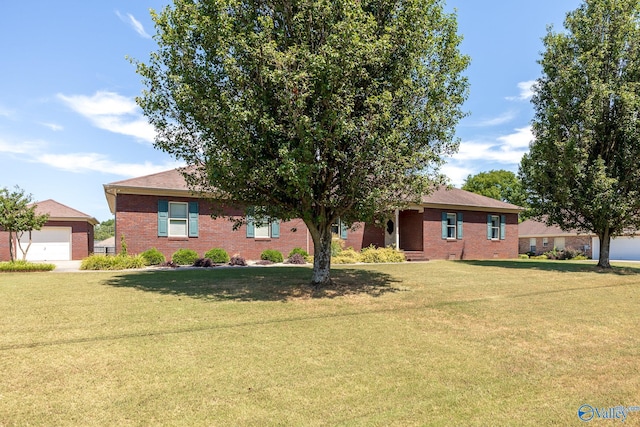 single story home with a garage and a front yard