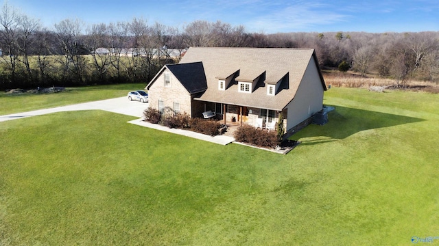 view of front of home featuring covered porch and a front lawn