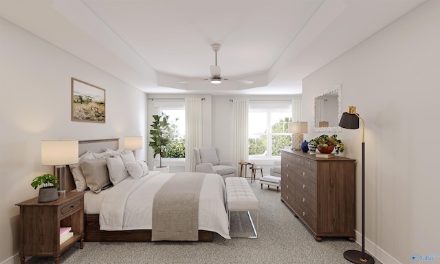 bedroom with a tray ceiling, carpet floors, and ceiling fan