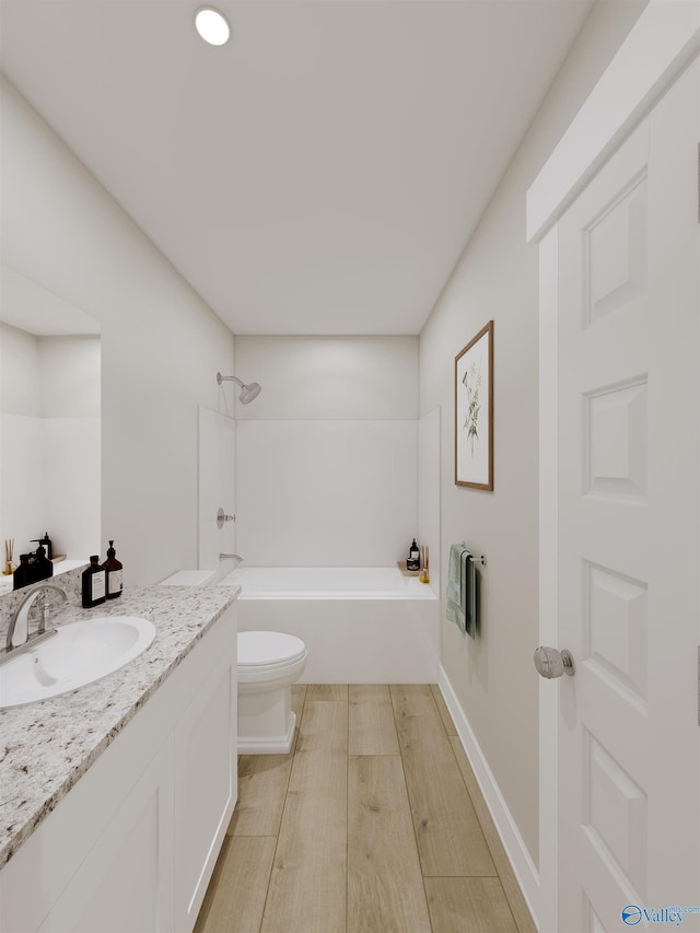 full bathroom featuring hardwood / wood-style flooring, vanity, bathtub / shower combination, and toilet