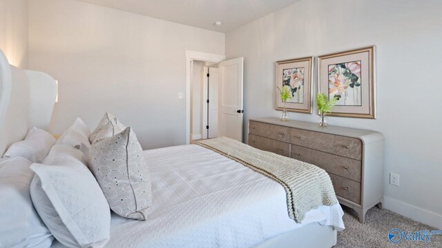 bedroom featuring light carpet