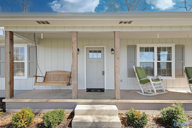 doorway to property with a porch