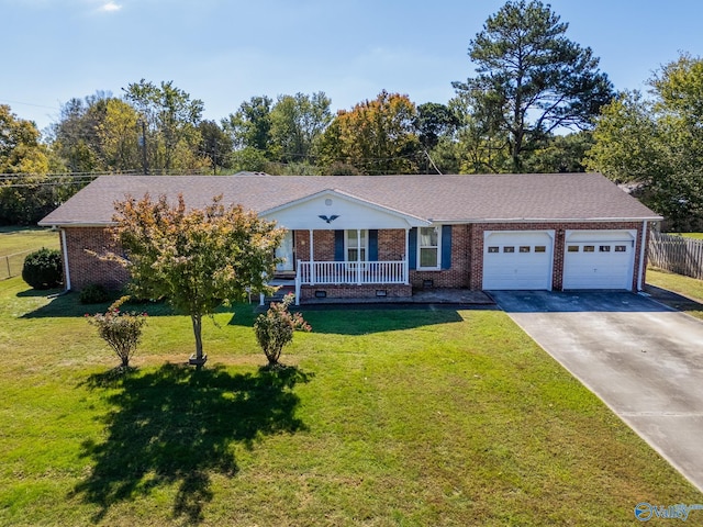 ranch-style home with a front yard, a garage, and a porch