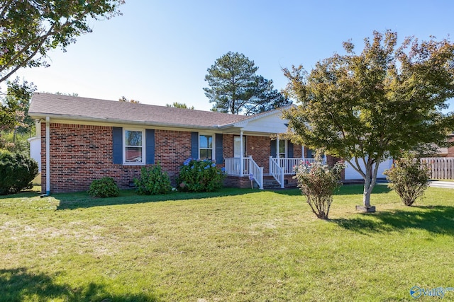 ranch-style home with a porch and a front yard