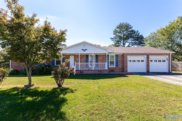 ranch-style house with a front yard, a garage, and a porch