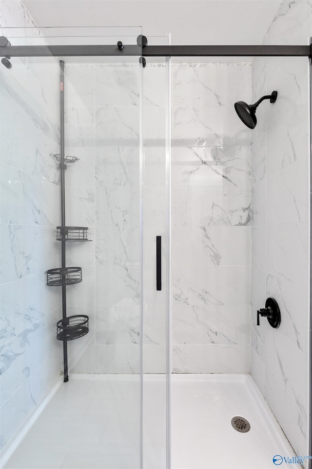 bathroom with a shower stall